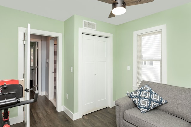 1342 Bertha St, Ferndale, MI 48220 - living area with dark wood-style floors, a ceiling fan, and baseboards