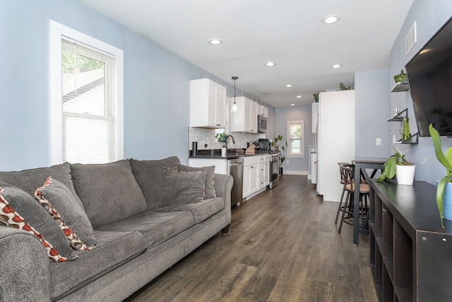 1342 Bertha St, Ferndale, MI 48220 - living room featuring dark wood finished floors and recessed lighting