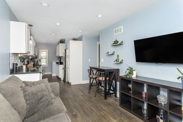 1342 Bertha St, Ferndale, MI 48220 - living area featuring dark wood-style floors, recessed lighting, and baseboards