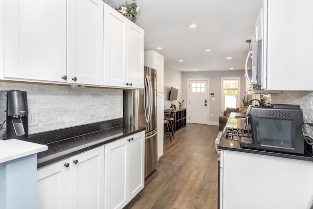 1342 Bertha St, Ferndale, MI 48220 - kitchen featuring stainless steel appliances, white cabinets, decorative backsplash, and recessed lighting