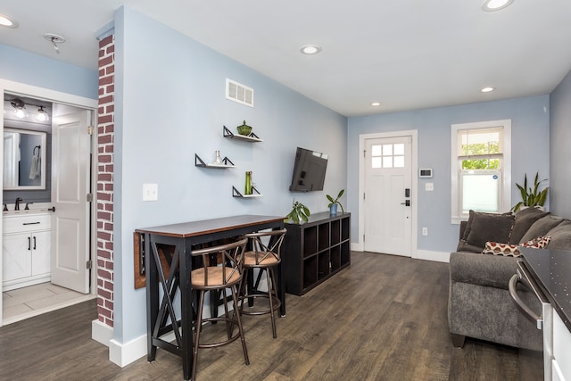 1342 Bertha St, Ferndale, MI 48220 - living area with dark wood-type flooring, recessed lighting, and baseboards