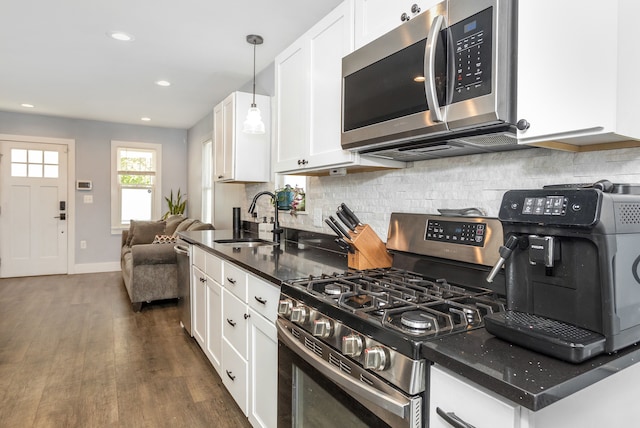 1342 Bertha St, Ferndale, MI 48220 - kitchen with stainless steel appliances, a sink, dark wood-type flooring, white cabinets, and recessed lighting