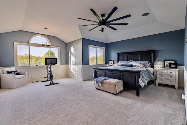 26930 Victory Ct, South Lyon, MI 48178 - carpeted bedroom with vaulted ceiling, a wainscoted wall, multiple windows, and a ceiling fan