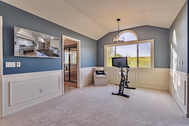26930 Victory Ct, South Lyon, MI 48178 - workout area featuring a chandelier, a wainscoted wall, carpet floors, lofted ceiling, and a decorative wall