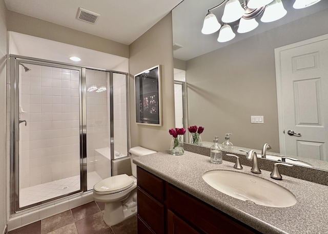 26930 Victory Ct, South Lyon, MI 48178 - full bathroom featuring a stall shower, toilet, vanity, and tile patterned flooring