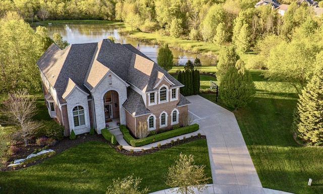 26930 Victory Ct, South Lyon, MI 48178 - aerial view of property and surrounding area with a nearby body of water and a forest