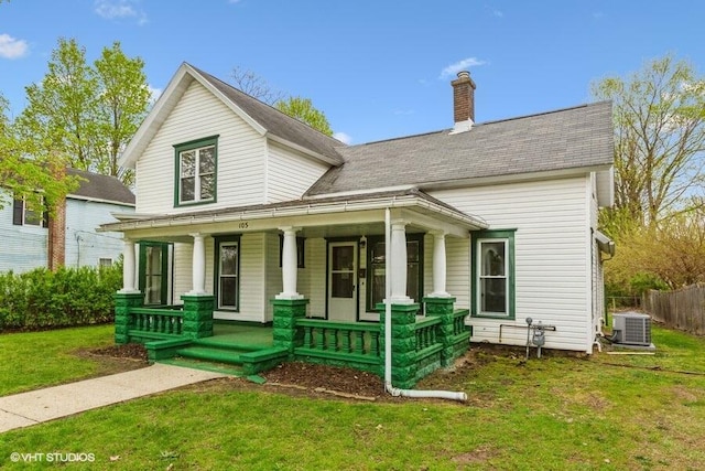 view of front facade featuring covered porch, a chimney, central air condition unit, and roof with shingles