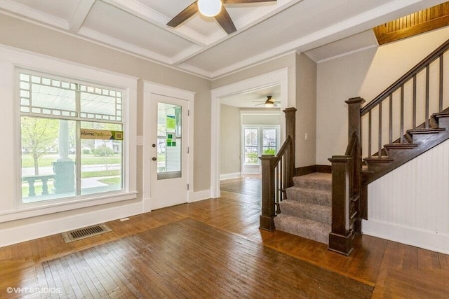 entryway with a ceiling fan, dark wood-style floors, stairs, ornamental molding, and baseboards