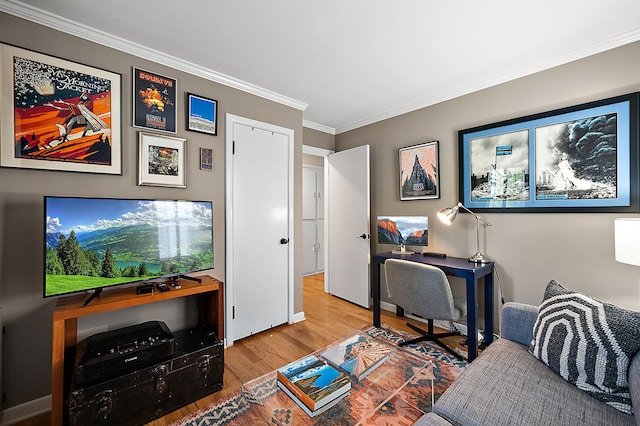 office space featuring wood finished floors, crown molding, and baseboards