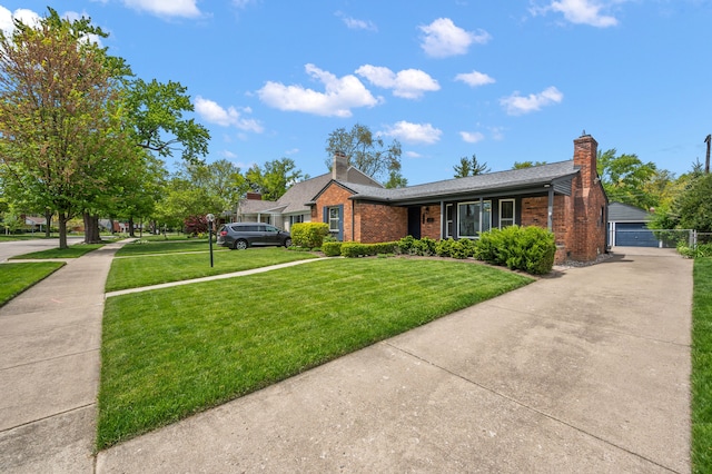 view of front facade featuring a front yard, brick siding, a chimney, and roof with shingles