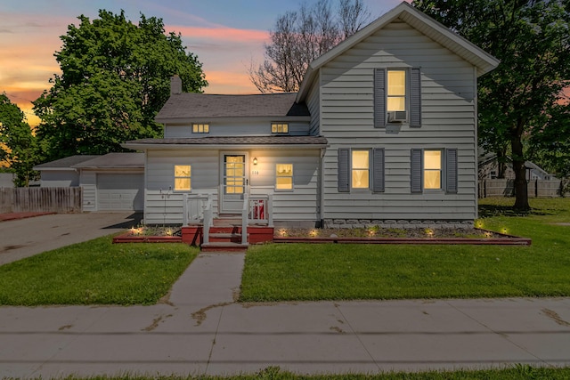 116 Silver St, Reading, MI 49274 - view of front of home featuring a chimney, driveway, cooling unit, and a garage