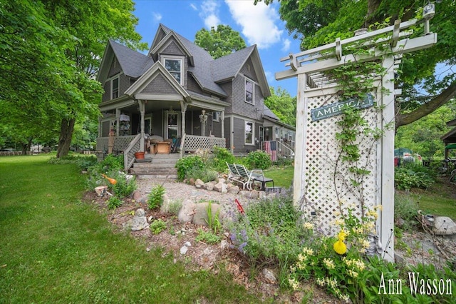 6951 S Vickeryville Rd, Sheridan, MI 48884 - view of front of home with a porch and a front yard