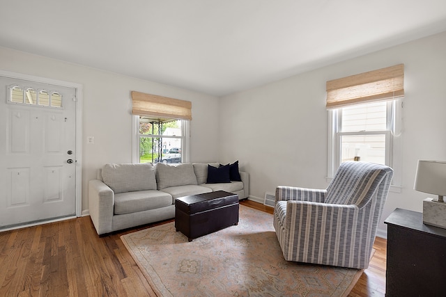 living room with wood finished floors and baseboards