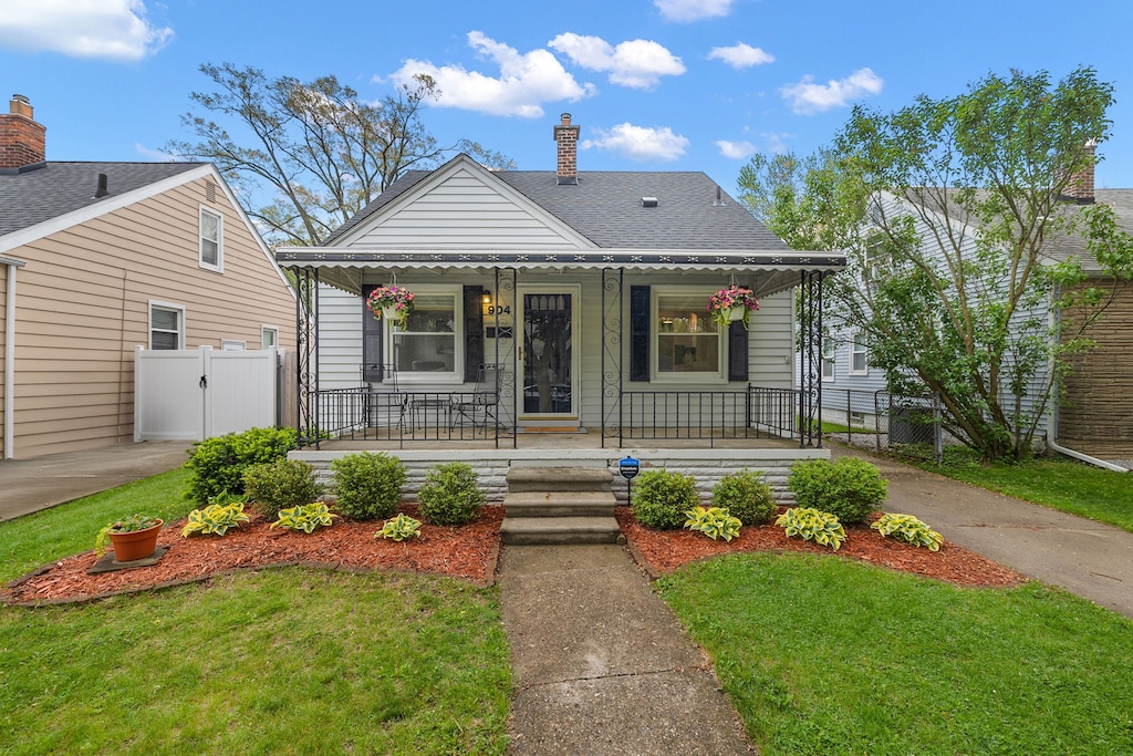 904 N Dorchester Ave, Royal Oak, MI 48067 - bungalow-style house featuring covered porch, a gate, a chimney, and roof with shingles