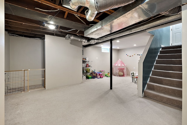 finished basement featuring carpet and stairway