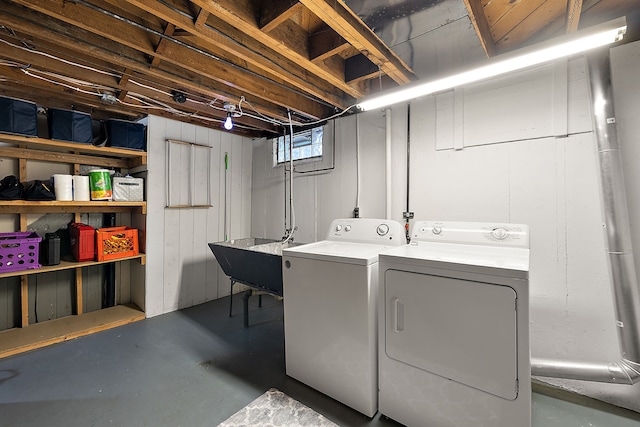 clothes washing area with washer and dryer