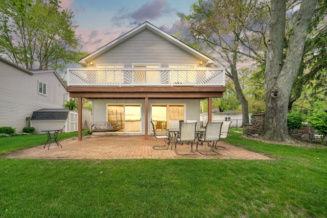 10194 Elmcrest Rd, Whitmore Lake, MI 48189 - rear view of house featuring a shed, an outbuilding, a patio area, and a yard