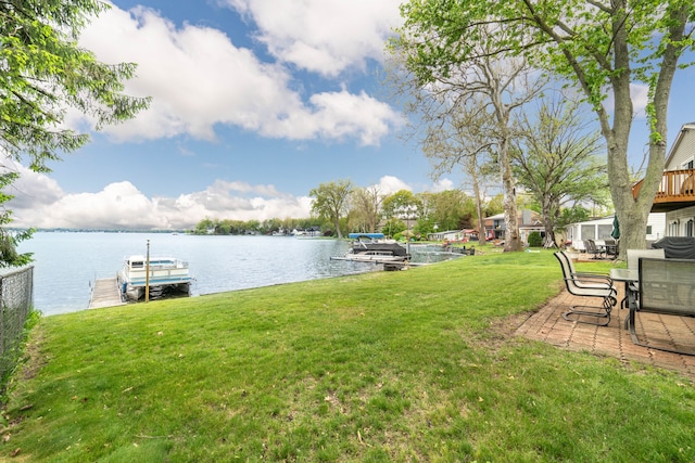 10194 Elmcrest Rd, Whitmore Lake, MI 48189 - view of grassy yard with a water view and a boat dock