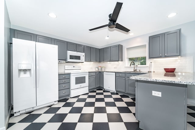 10194 Elmcrest Rd, Whitmore Lake, MI 48189 - kitchen with white appliances, dark floors, gray cabinetry, and recessed lighting