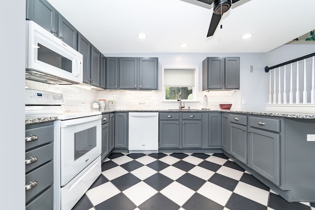 10194 Elmcrest Rd, Whitmore Lake, MI 48189 - kitchen featuring white appliances, dark flooring, a ceiling fan, tasteful backsplash, and a sink