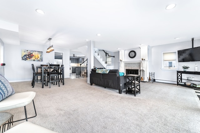 10194 Elmcrest Rd, Whitmore Lake, MI 48189 - living area with carpet flooring, stairs, recessed lighting, a fireplace, and baseboards