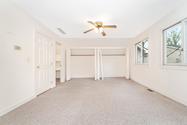 10194 Elmcrest Rd, Whitmore Lake, MI 48189 - unfurnished bedroom featuring carpet floors, multiple closets, baseboards, and ceiling fan