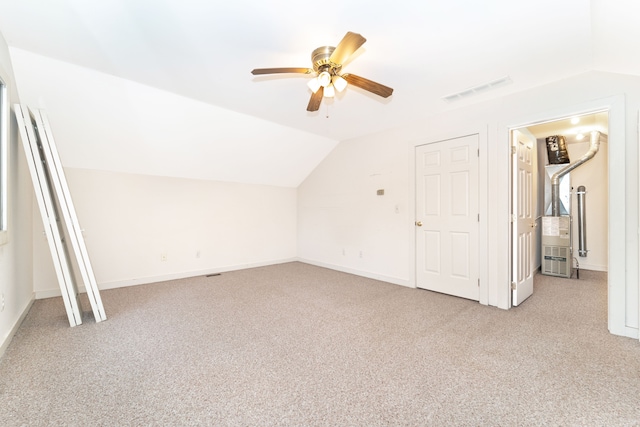 10194 Elmcrest Rd, Whitmore Lake, MI 48189 - additional living space featuring light colored carpet, vaulted ceiling, a ceiling fan, and baseboards