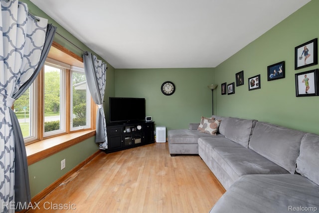 94 Crescent Lake Rd, Waterford, MI 48327 - living area with light wood-style flooring and baseboards