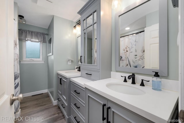 94 Crescent Lake Rd, Waterford, MI 48327 - full bath with vanity, baseboards, and wood finished floors