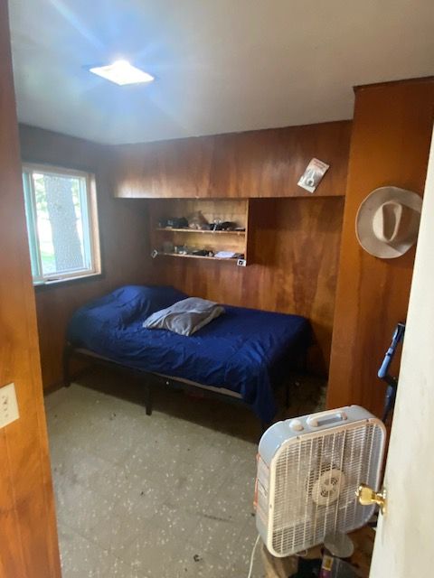 437 W Mount Morris St, Mount Morris, MI 48458 - bedroom with wood walls