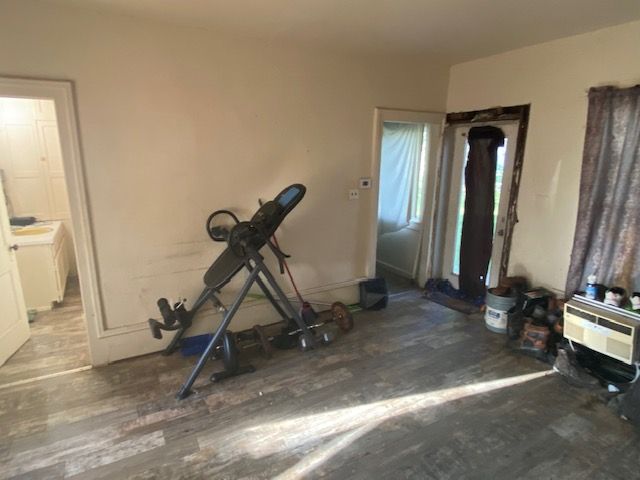 437 W Mount Morris St, Mount Morris, MI 48458 - exercise room with wood finished floors and baseboards