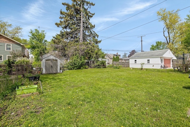 view of yard featuring a storage shed and an outdoor structure