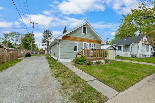 view of front of house featuring driveway, an outdoor structure, and a garage