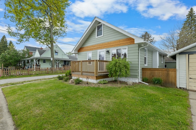 back of house with a wooden deck