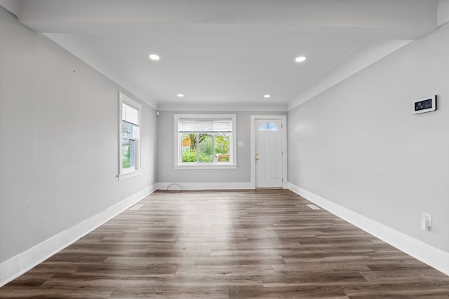 foyer entrance featuring baseboards, recessed lighting, wood finished floors, and ornamental molding