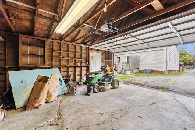 7244 Neff Rd, Mount Morris, MI 48458 - garage featuring a garage door opener