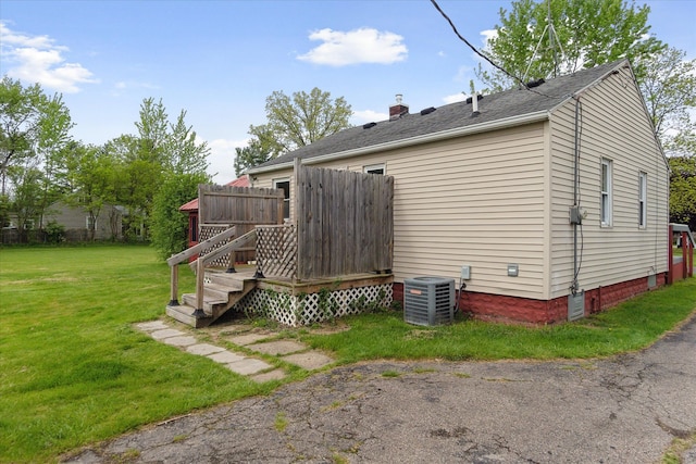 7244 Neff Rd, Mount Morris, MI 48458 - rear view of property featuring cooling unit and a yard