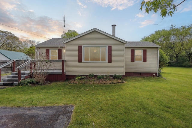 7244 Neff Rd, Mount Morris, MI 48458 - rear view of house featuring a lawn, a wooden deck, and roof with shingles