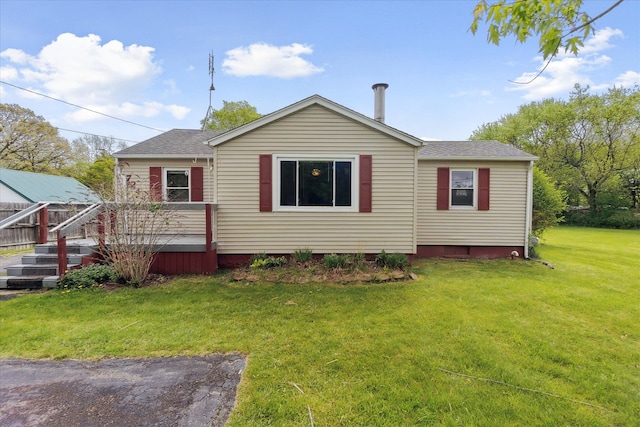 7244 Neff Rd, Mount Morris, MI 48458 - rear view of house featuring a lawn, a deck, and a shingled roof
