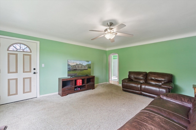 7244 Neff Rd, Mount Morris, MI 48458 - living room with a ceiling fan, carpet flooring, baseboards, and arched walkways