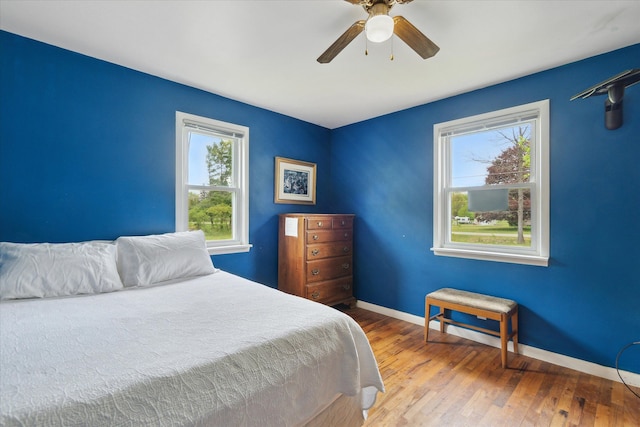 7244 Neff Rd, Mount Morris, MI 48458 - bedroom featuring baseboards, wood finished floors, and ceiling fan