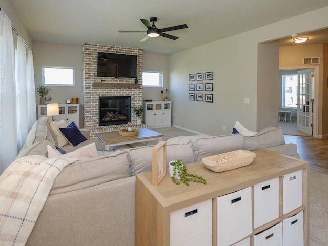 59376 Silvergrass Ave, Mattawan, MI 49071 - living room with plenty of natural light, a fireplace, ceiling fan, and baseboards