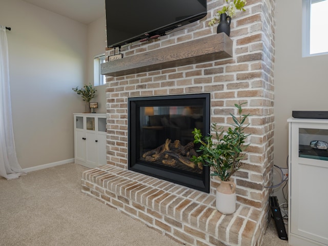 59376 Silvergrass Ave, Mattawan, MI 49071 - detailed view of carpet flooring, a brick fireplace, and baseboards