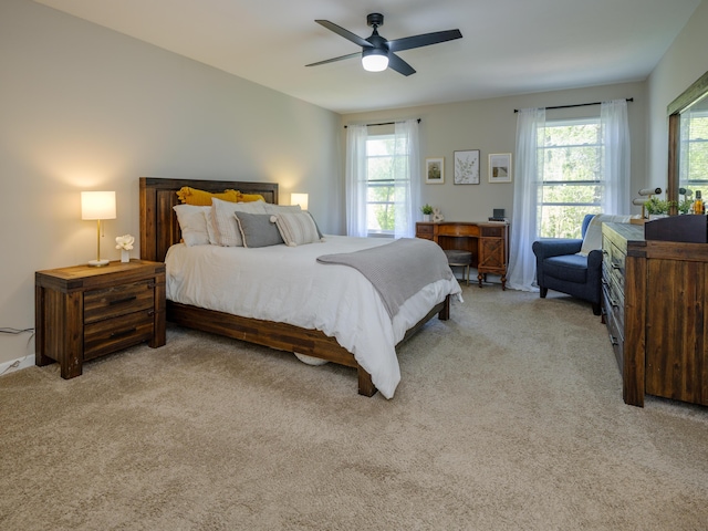 59376 Silvergrass Ave, Mattawan, MI 49071 - bedroom featuring multiple windows, light carpet, and a ceiling fan