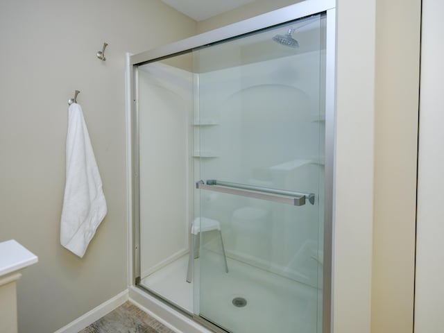 59376 Silvergrass Ave, Mattawan, MI 49071 - bathroom featuring a stall shower and baseboards