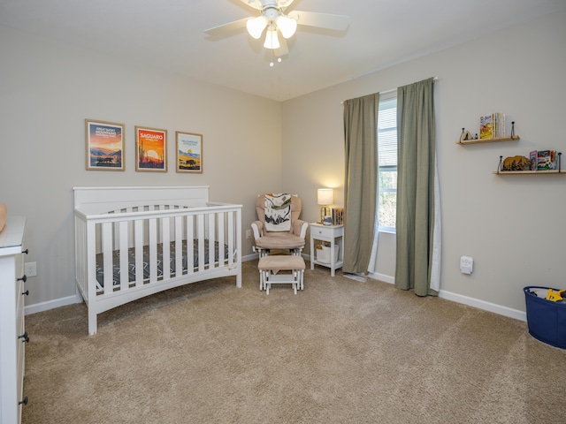 59376 Silvergrass Ave, Mattawan, MI 49071 - bedroom featuring carpet floors, a nursery area, baseboards, and a ceiling fan