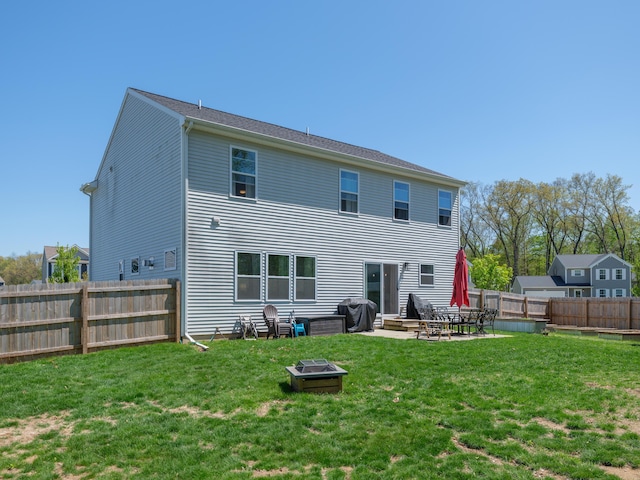59376 Silvergrass Ave, Mattawan, MI 49071 - rear view of property with a patio area and a fire pit
