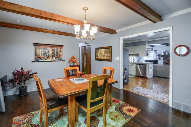 10186 Carlee June Dr, Fenton, MI 48430 - dining room with a chandelier, beam ceiling, dark wood-style flooring, baseboards, and crown molding