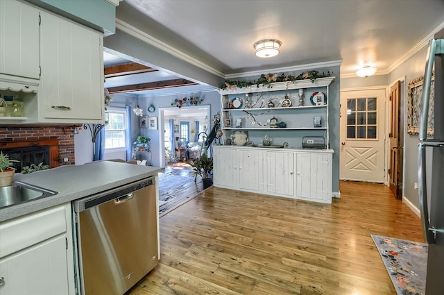 10186 Carlee June Dr, Fenton, MI 48430 - kitchen featuring appliances with stainless steel finishes, open shelves, ornamental molding, light wood-type flooring, and light countertops