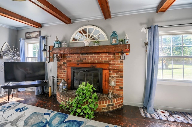 10186 Carlee June Dr, Fenton, MI 48430 - living area featuring beam ceiling, a fireplace, wood finished floors, baseboards, and crown molding